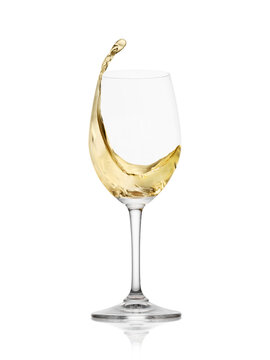 White wine in a glass with splash isolated on white background