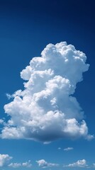 Naklejka na ściany i meble Cumulonimbus Cloud Towering in Blue Sky