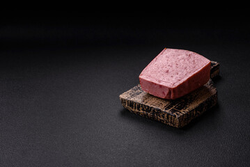 Delicious canned pink ham with salt, spices and herbs