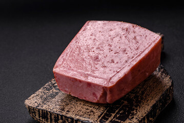 Delicious canned pink ham with salt, spices and herbs