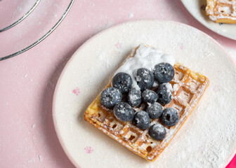 waffles with blueberries,Delicious Belgian waffles with berries