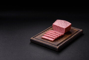 Delicious canned pink ham with salt, spices and herbs