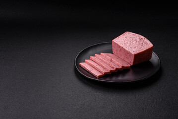 Delicious canned pink ham with salt, spices and herbs