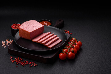 Delicious canned pink ham with salt, spices and herbs