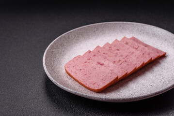 Delicious canned pink ham with salt, spices and herbs