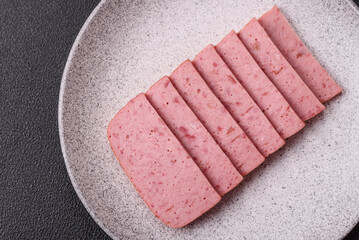Delicious canned pink ham with salt, spices and herbs