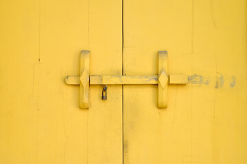vibrant classic hardwood door with wooden latch lock and metallic key