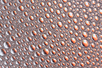 Abstract orange macro background with lots of soap bubbles.