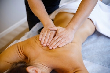 Fototapeta na wymiar Soothing Touch: Wellness Expert Treats Client to Back Massage