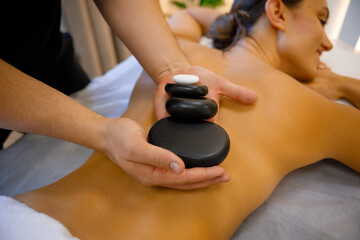 Obraz na płótnie Canvas Soothing Stone Massage for Wellness