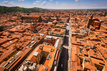 Bologna, skyline cityscape from Asinelli tower, Two Towers, Due Torri. Buildings, tiled roofs and streets of Bologna. Italian red city. Panoramic view of Bologna city.