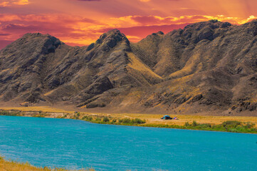 Enjoy the serenity of the sunset over the calm river. Enjoy the beauty of majestic mountains and...