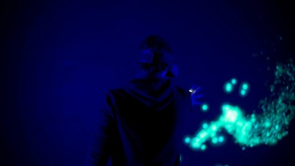 Man silhouette wearing virtual reality glasses stands in front of digital screen cyber manipulates...