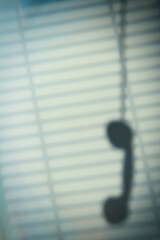 Shadow Of Hanging Phone Receiver
