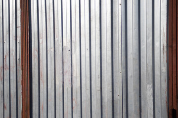 Steel wall. Garage for a car. Silver metal profile.