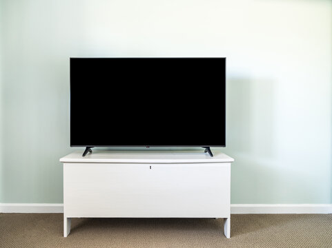 modern interior with tv on white cabinet
