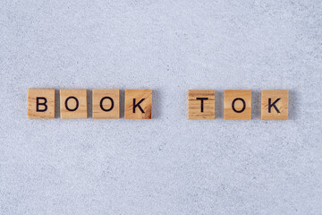 Book tok phrase made of wooden letters. Words booktok