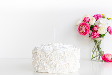 Cake topper mock up . Styled with colorful flowers against a white background. Close up birthday ,...