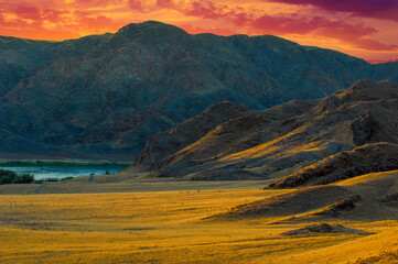 Enjoy the beauty of the Central Asian sunset in nature. Explore unique rock formations along the river in the steppe. Connect with nature and immerse yourself in the natural landscapes o Central Asia.