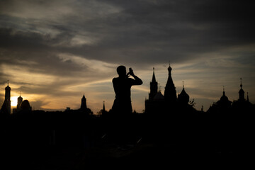 Fototapeta na wymiar Tourist in Moscow. Man in Russia. Silhouette of a man against the backdrop of Moscow.