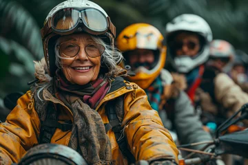Fototapeten Smiling happy senior women on a motorcycle trip through the countryside © Craig