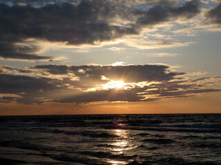 Fototapeta na wymiar Wonderful sunset on the beach in Warnemünde