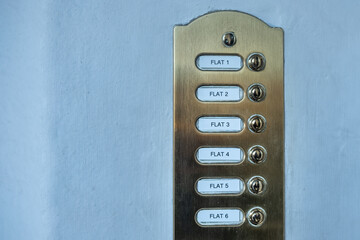 London street flat / apartments. Door entry system showing flat numbers and buttons.