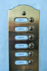 London street flat / apartments. Door entry system showing flat numbers and buttons.