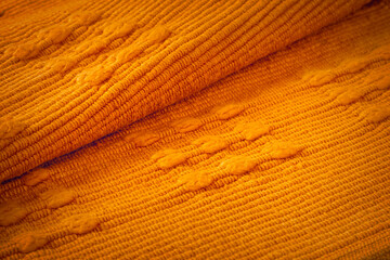 Gold cotton fabric background with fold