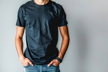 Casual Black T-Shirt on Young Man Against Grey Background
