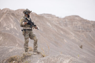 Soldier guarding the area on the mountain