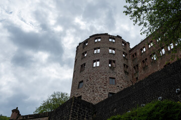 Fototapeta na wymiar Heidelberg castle tower, Germany nature. Under view of old fortress ruins, cloudy sky background.