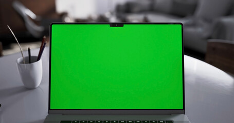 Laptop place on living room table, Green screen display, Close up monitor of notebook with mock up - 756650873