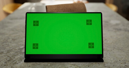 Tablet place on kitchen table, Green screen touchscreen, Close up display digital with mock up - 756654081