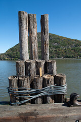 Naklejka premium Mooring posts on a river pier