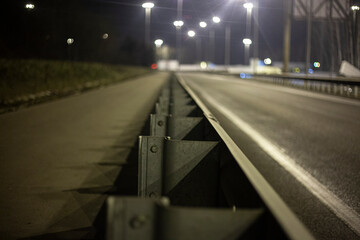 Obstacle from the car. Chipper on the road. Night track.