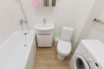 modern bathroom room with toilet and washing machine