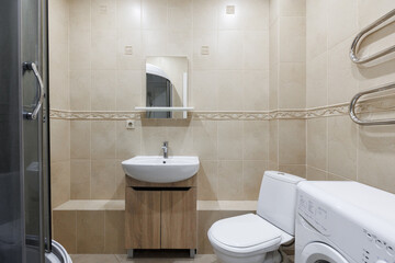 modern bathroom room with toilet and washing machine
