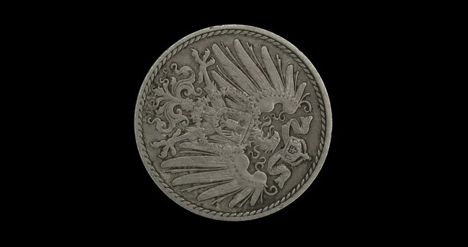 Obverse of Geman Empire coin 5 pfennig 1908, isolated in black background. Seamless animation in 4k resolution video.