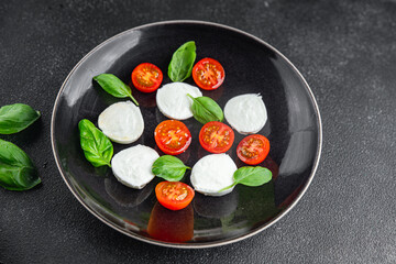 caprese salad mozzarella, tomato, basil fresh food tasty healthy eating cooking appetizer meal food snack on the table copy space food background rustic top view