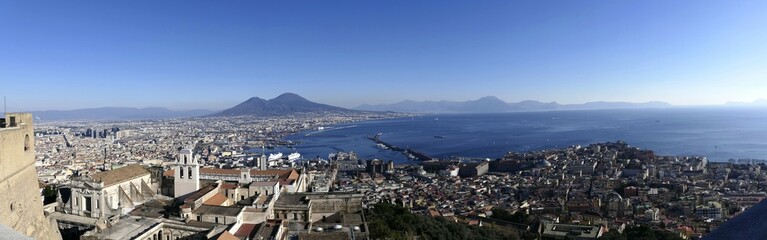 
Panoramic view city of Naples, the Gulf of Naples, the Vesuvius volcano and the island of Capri. Castel Sant'Elmo, medieval fortress located on Vomero Hill. The Certosa di San Martino. Naples. Italy
