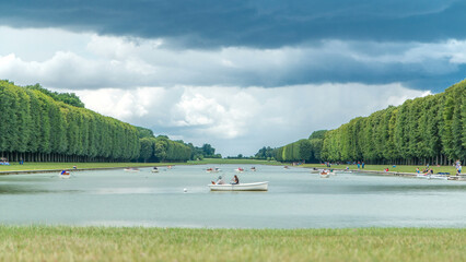 The Grand Canal of the Palace of Versailles with boats timelapse in France.