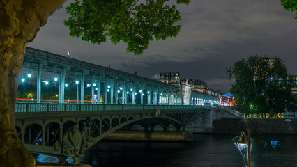 View of pont de Bir-Hakeim night timelapse - a bridge that crosses the Seine River. Paris, France