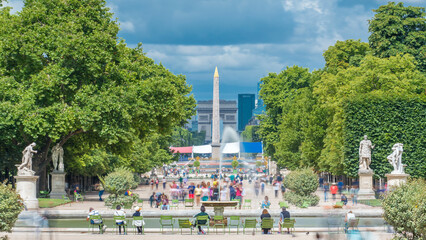 People relaxing in Tuileries Palace open air park timelapse. Paris, France
