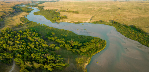 aerial panorama of the Dismal River meandering through Nebraska Sandhills at Nebraska National Forest, late summer scenery