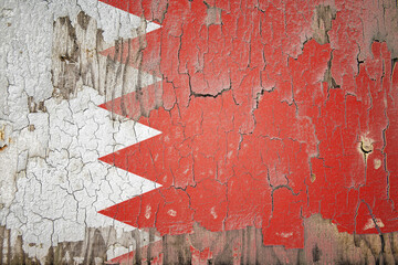 Bahrain flag painted on the cracked wall
