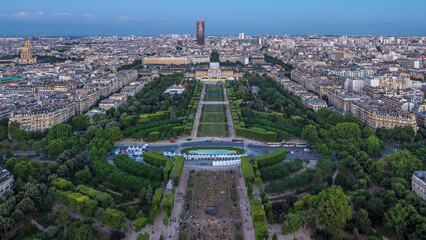 Aerial view of a large city skyline after sunset day to night timelapse. Top view from the Eiffel...