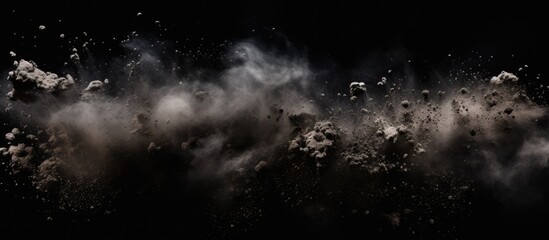 A dark sky filled with cumulus clouds releasing smoke, creating a mysterious and atmospheric midnight event. The black background enhances the dramatic meteorological phenomenon