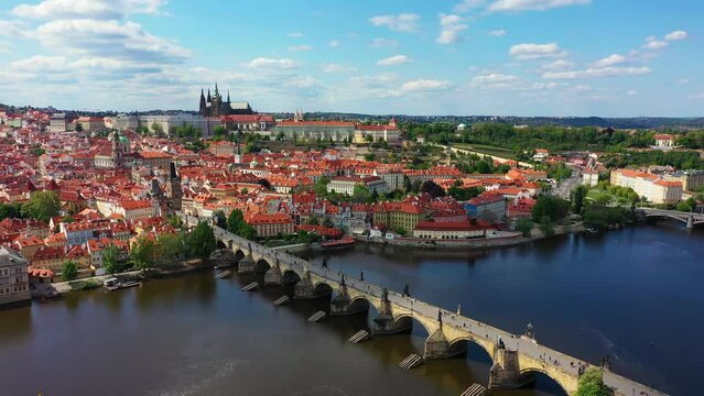 Prague scenic spring aerial view of the Prague Old Town pier architecture and Charles Bridge over Vltava river in Prague, Czechia. Old Town of Prague, Czech Republic.