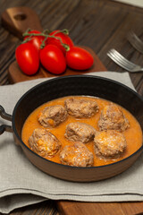Meat balls in meat sauce in a frying pan